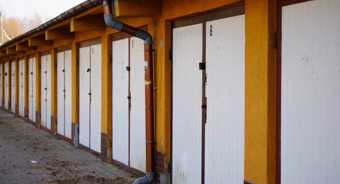 Row Of White Locked Garage Doors